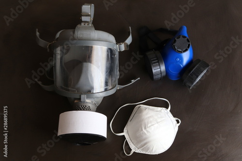 Different selection of respirators or face masks.The masks are designed to protect your lungs from different levels of hazardous materials that could damage the lungs. photo