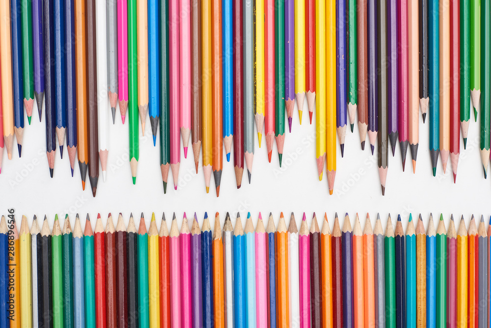 Rows of sharpened color pencils isolated on white Rows of sharpened color pencils isolated on white