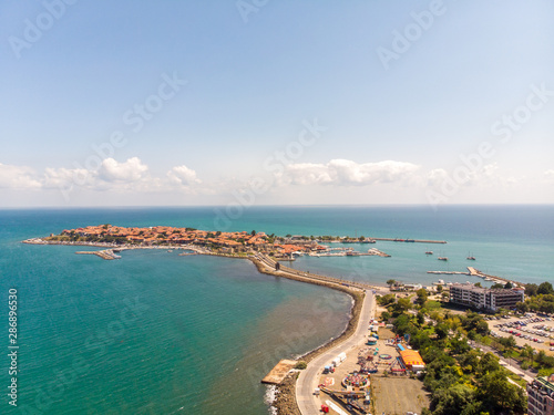 Aerial photo of the beautiful town of Nessebar, located in the Sunny Beach area of Bulgaria, taken with a drone on a bright sunny day showing the houses and businesses of the town
