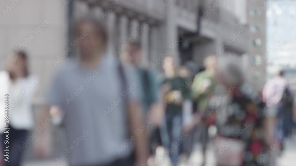 Blurred background of pedestrians in the city walking - great for text overlay Blurred background of pedestrians in the city walking - great for text overlay