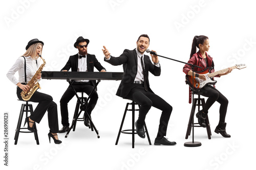 Music band with a guitarist, sax and keyboard and a singer