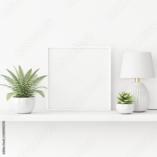 Fototapeta Naklejka Na Ścianę i Meble -  Interior poster mockup with square white frame standing on the table with plants in pots and lamp on empty wall background. 3D rendering, illustration.