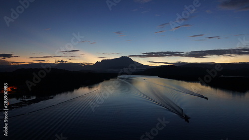 Mount Kinabalu during sunrise over Sulaman River Bridge photo