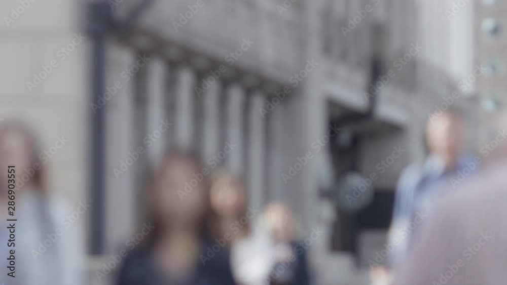 Blurred background of commuters walking in the city one morning, in slow motion Blurred background of commuters walking in the city one morning, in slow motion