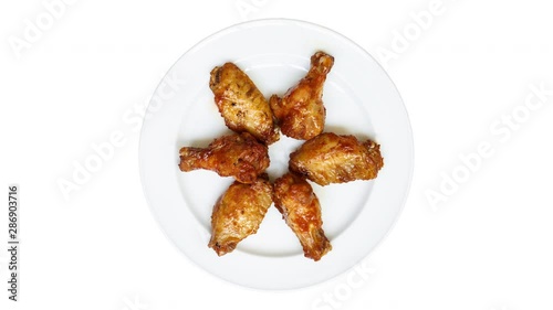 Spicy ,Chicken,wing,rotating,white,spinning,top view,white,background,chicken drumstick,marinade,above,appetizer, dish; isolated; barbecue;food;bbq;roasted;meat; tasty; fresh; delicious; meal; lunch; 