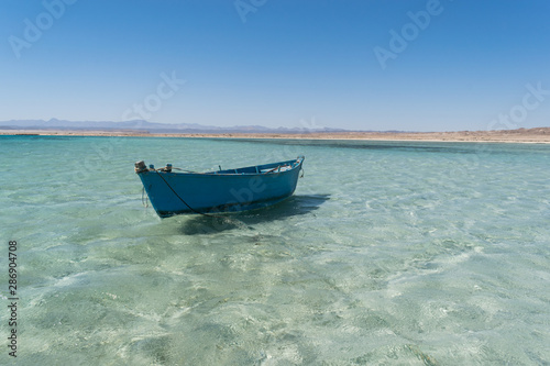 Small boat at Hankorab beach, Wadi El Gemal protectorate, Marsa Alam, Red Sea, Egypt