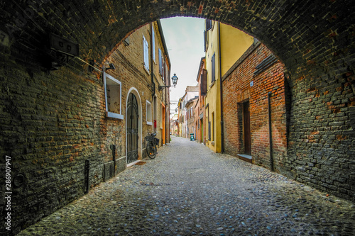 Ferrara, Italy - August, 9, 2019: landscape with the image of a street in a center of Ferrara