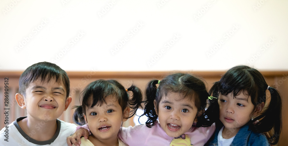 Portrait of happy children having fun in the bedroom. Portrait of happy children having fun in the bedroom.