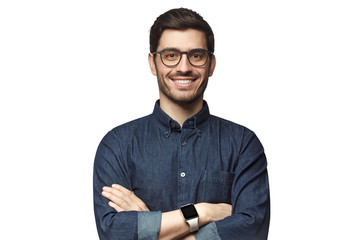Portrait of young smiling caucasian man with crossed arms, wearing smart watch and casual denim shirt, isolated on white