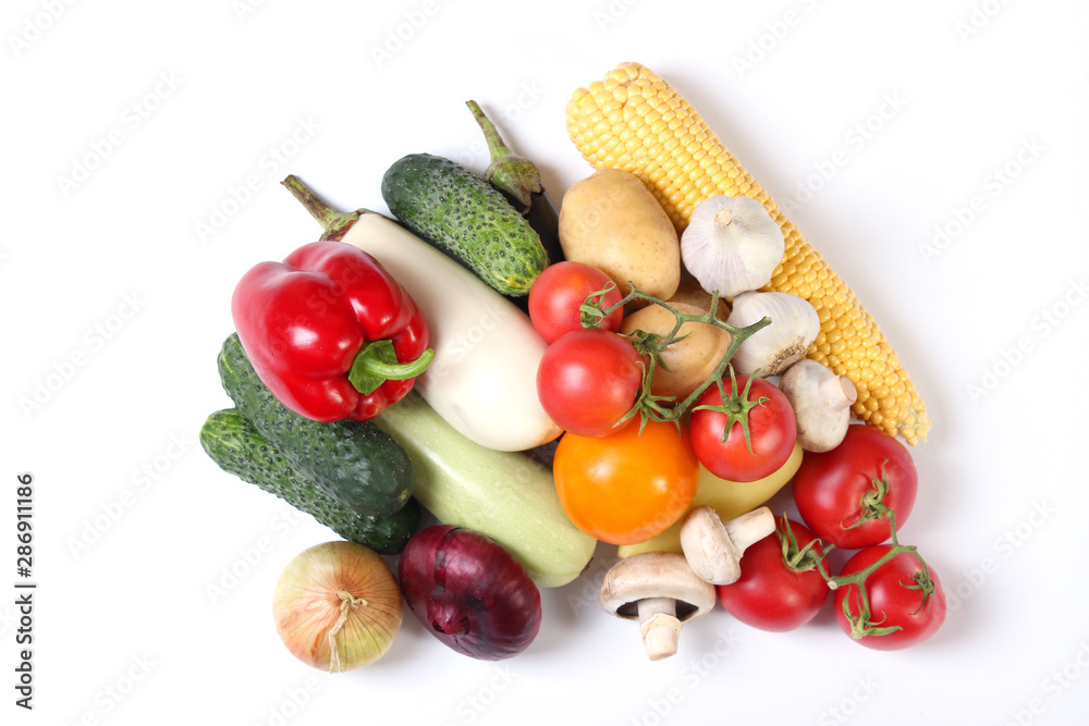 Set of different fresh vegetables on a white background top view. Set of different fresh vegetables on a white background top view.
