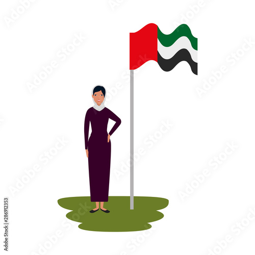 islamic woman with traditional burka and arabia flag in pole