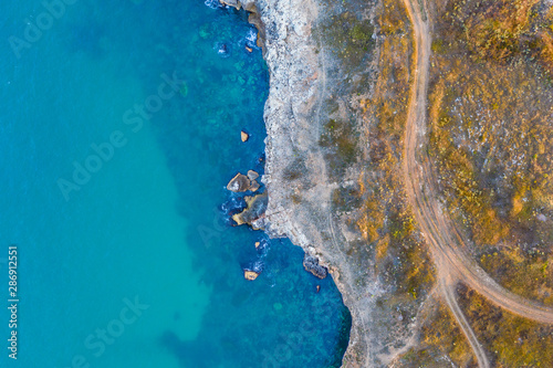 Aerial top-down view of a rocky seashore 