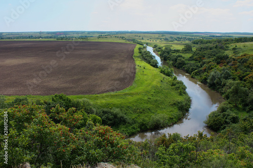 Steppe landscape with field and river © alex