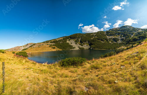 Mountain summer landscape panoramic view with beautiful Yonchevo lake, Rila national park, Bulgaria