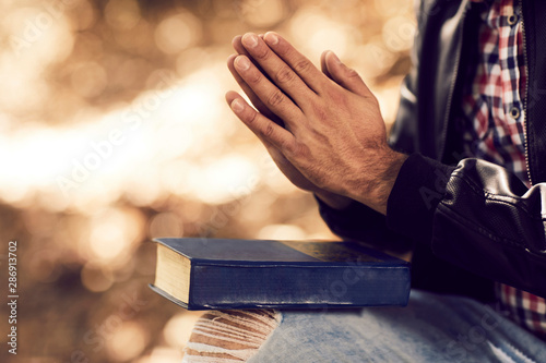 Man praying outdoors