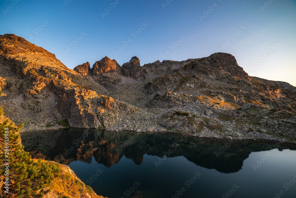 Amazing landscape of The Scary lake during warm summer sunset, Rila mountain national park, Bulgaria