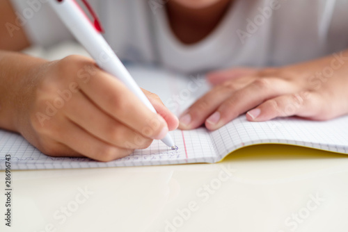 child doing homework at home