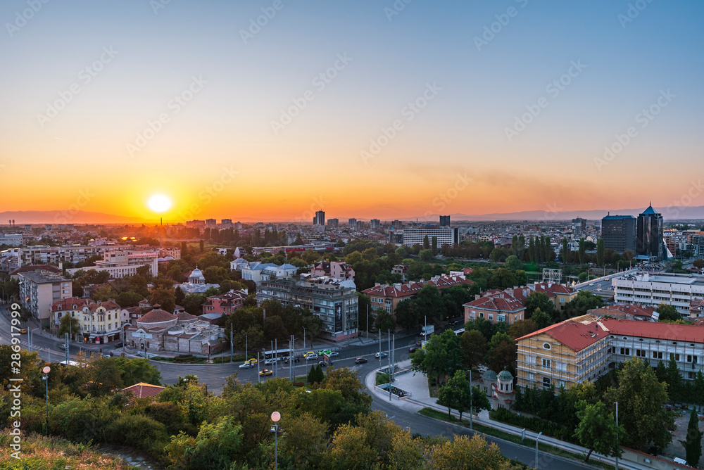 Warm summer sunset from Nebet tepe Hill in Plovdiv city, Bulgaria. Panoramic view from the oldest european city. Ancient city is UNESCO's World Heritage.