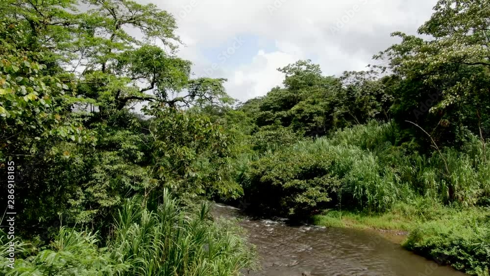 Aerial shot of a river in the middle of the jungle near the Arenal Volcano in Costa Rica Aerial shot of a river in the middle of the jungle near the Arenal Volcano in Costa Rica