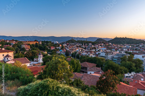 Warm summer sunset from Nebet tepe Hill in Plovdiv city, Bulgaria. Panoramic view from the oldest european city. Ancient city is UNESCO's World Heritage.