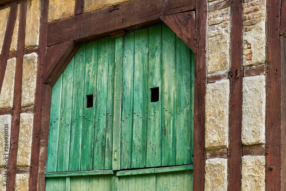 Wooden construction on the wall of an old half-timbered house. The building is being renovated. Wooden construction on the wall of an old half-timbered house. The building is being renovated.