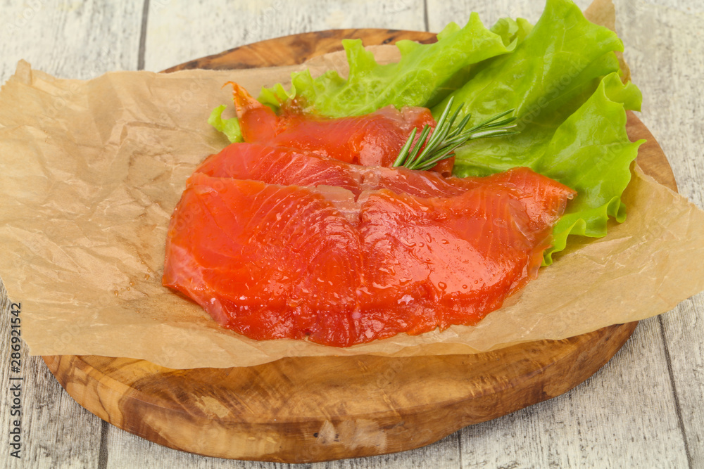 Sliced salmon fillet served rosemary Sliced salmon fillet served rosemary