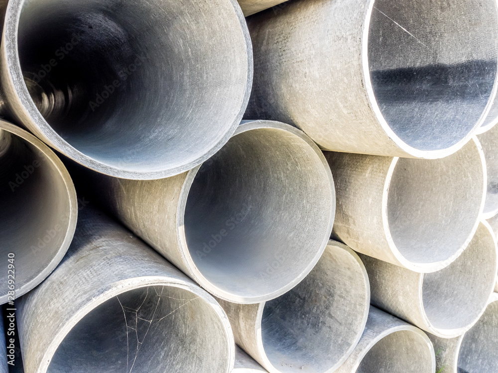 Close up image of pile grey steel pipes at the construction site. Industrial concept. Close up image of pile grey steel pipes at the construction site. Industrial concept.