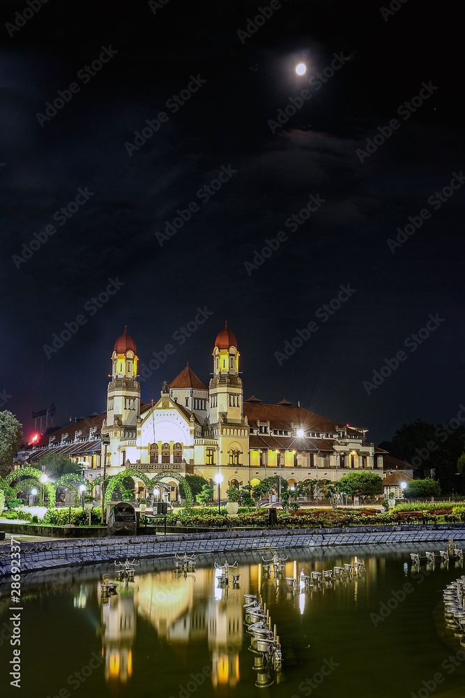 Reflection of Lawang Sewu Architecture at night in Semarang, Indonesia.