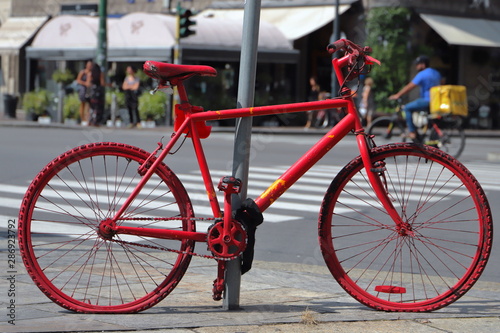old red bicycle in the street 