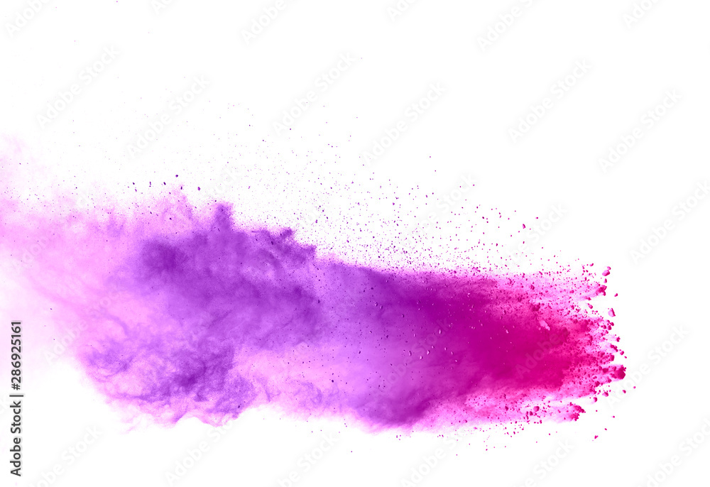 Freeze motion of purple color powder exploding on white background. Freeze motion of purple color powder exploding on white background.
