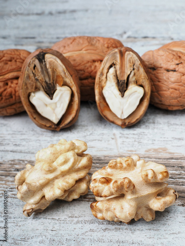 Fresh walnuts on the wooden background