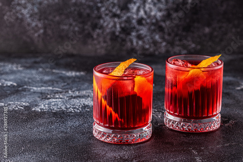 Quadro su tela Negroni cocktail with orange peel and ice.