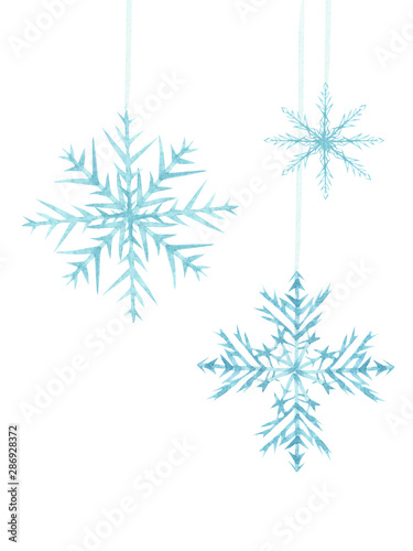 Watercolor hand painted winter composition with white blue three different snowflakes hand on a threads isolated on the white background set
