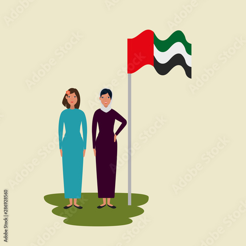 islamic women with traditional burka and arabia flag in pole