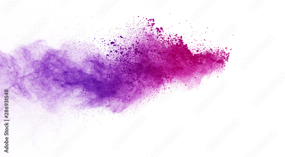 Freeze motion of purple color powder exploding on white background. Freeze motion of purple color powder exploding on white background.