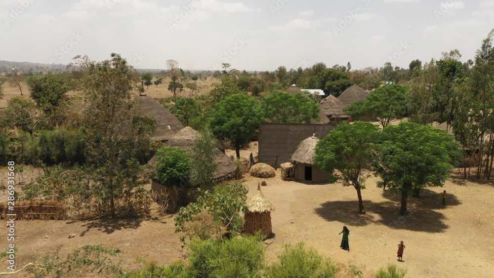 Flying over straw rooftops of traditional homes in rural community in South Ethiopia Flying over straw rooftops of traditional homes in rural community in South Ethiopia