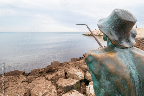 Fisherman sculpture at Vollga Waterfront Promenade photo