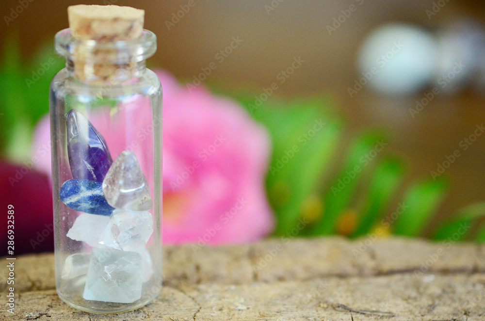 Apothecary Healing Crystal Variety in glass vial. Witches decor: Iris Quartz, Herkimer Diamond, Quartz, Fluorite, Lapis Lazuli, Amethyst. Glass bottle with crystals in it. Colorful crystal collection. Apothecary Healing Crystal Variety in glass vial. Witches decor: Iris Quartz, Herkimer Diamond, Quartz, Fluorite, Lapis Lazuli, Amethyst. Glass bottle with crystals in it. Colorful crystal collection.