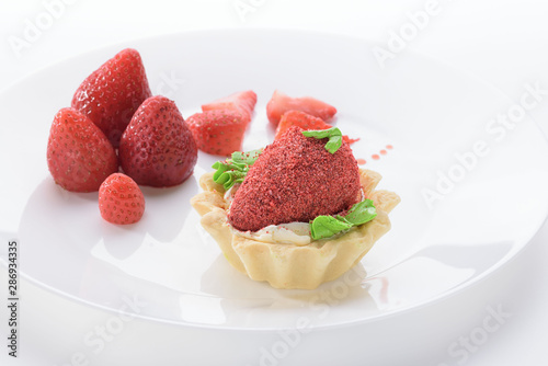 strawberry dessert on a white plate. White background. Strawberry.