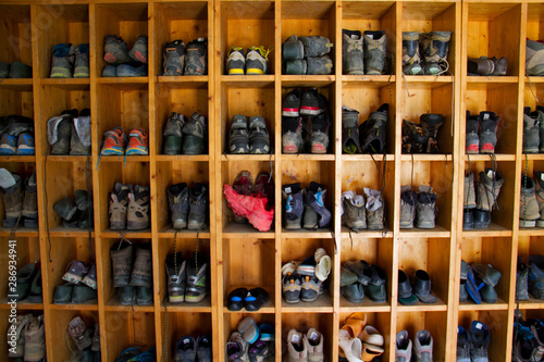 Collection of hiking boots in a mountain cabin in the Pyrenees