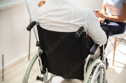 Disabled Businessman In Meeting