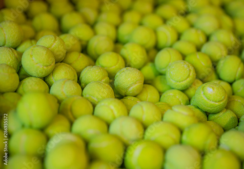 The confectionery store. Tray with green candy in the form of tennis balls. Sweets are chaotic. Selective focus. © ROMAN DZIUBALO