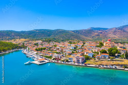 Scenic aerial view of Galaxidi village with colorful buildings, Greece © gatsi