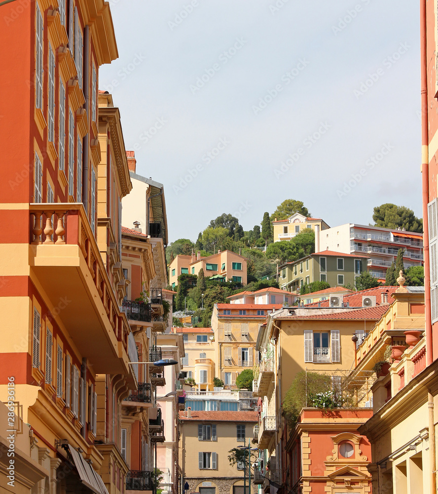 Old town perspective with hill in the back - Menton, French Riviera