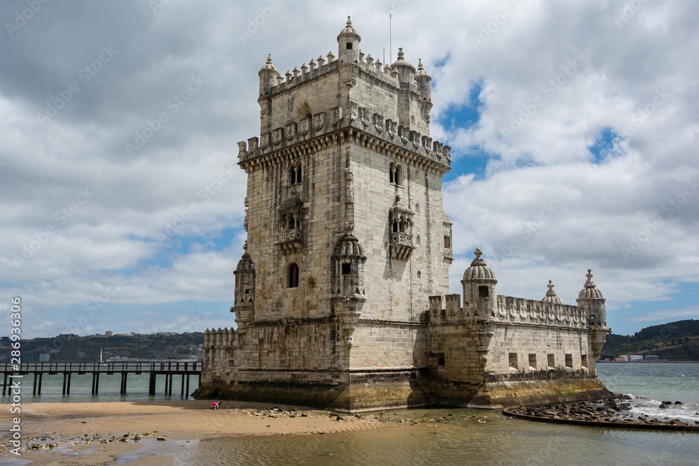 Old tower over a cloudy sky in Lisbon, Portugal