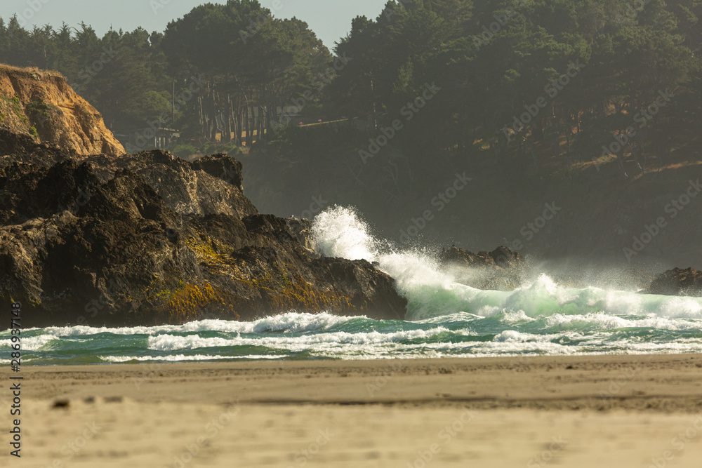 Ocean waves crash on the rocky shoreline of the Mendocino coast