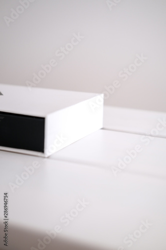 Beauty product packaging boxes in white and black © Iuliia