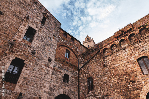 Bottom view of castle walls, ancient city, San Gimignano, Italy