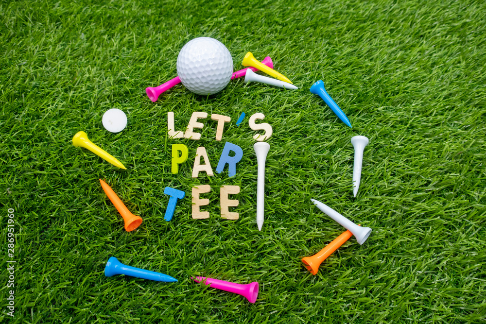 Golf let par tee party invitation for golfer party with golf ball and  colourful tees on green grass Stock Photo | Adobe Stock