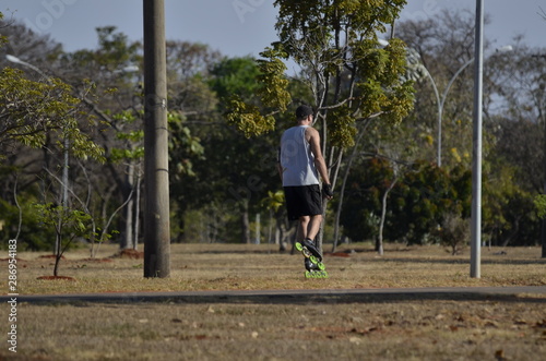 A beautiful view of people walking with rollerblades in Brasilia park, Brazil